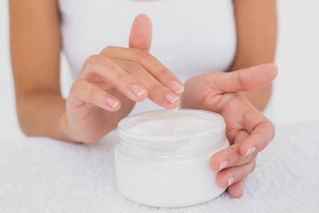 Applying cetomacrogol cream on skin